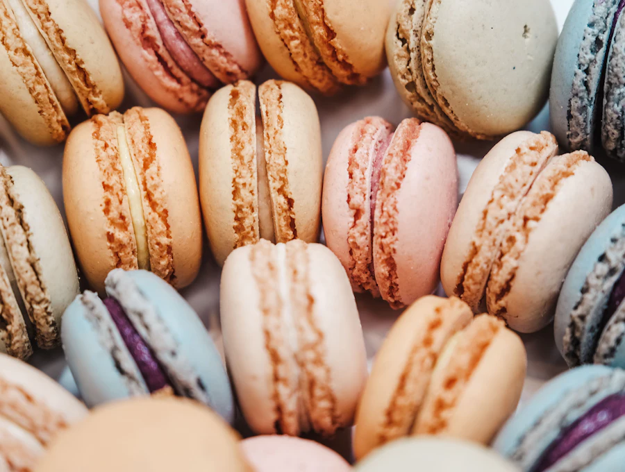 Rows of pastel macarons in cream, pink and lavender